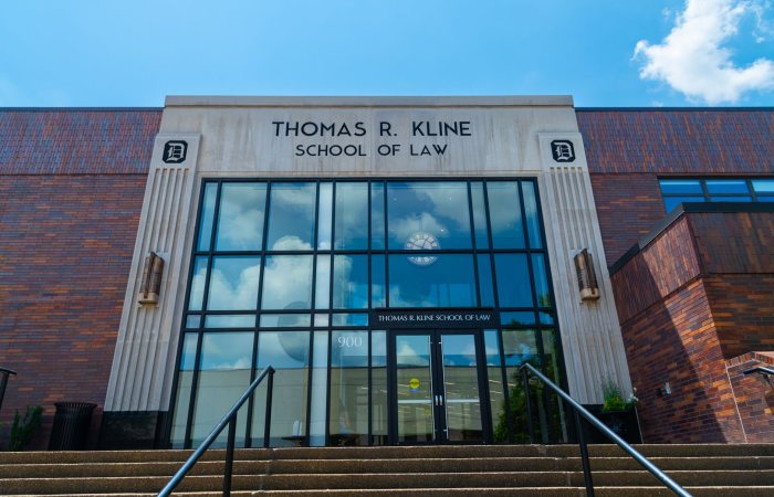 Front view of Thomas R. Kline School of Law building on a sunny day with clear sky.