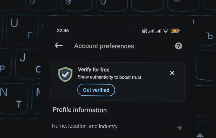 Close-up of a smartphone screen displaying account verification alert. Ideal for security and authenticity themes.