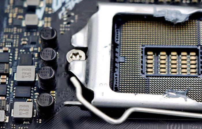 Detailed close-up image of a CPU socket and components on a motherboard.